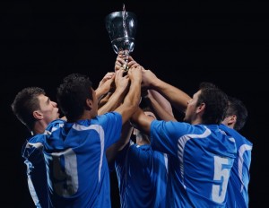 soccer players celebrating victory