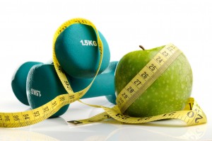 healthy apple, measuring tape and dumbbells isolated